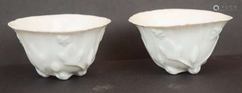 Pair of porcelain wine cups. China. 18th/19th century. Ti Hua ware. Shaped in the form of flowers with butterflies. 3-1/2