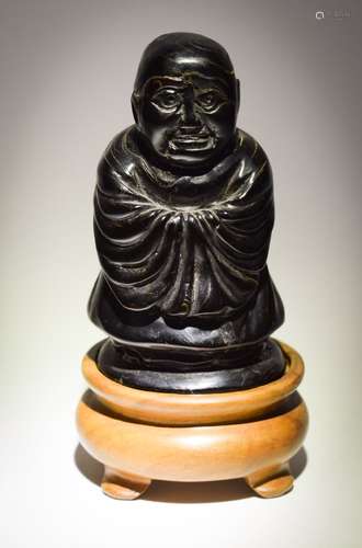 Carved horn figure of a monk. China. 19th cent. 2-1/2