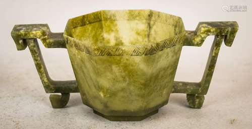 Jade wine cup. China. 17th cent. Octagonal form with handles. Highly translucent grey-green stone. 6