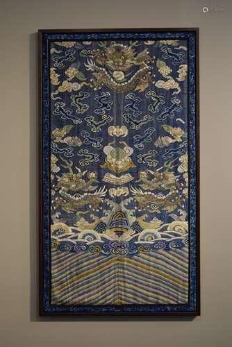 Tapestry weave panel. China. K'ossu work of dragons and clouds on a blue ground. Framed. Overall size: 48