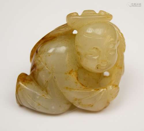 Jade carving. China. 19th century. Grey stone with russet marking. Small boy with a lotus flower. 1-1/4