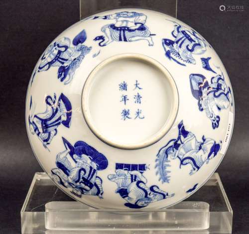 Porcelain bowl. China. Kuang Hsu mark (1875-1908) and of the period. Underglaze blue decoration of the Immortals with a central reserve of Shao Lao with a deer. Kiln crack at the rim.