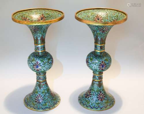 Pair of Cloisonné vases. China. Early 20th century. Rounded Ku form. Decoration of lotus scrolling on a turquoise ground. Ch'ien Lung marks. 9