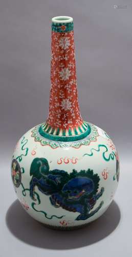 Porcelain bottle vase. China. Early 20th century. Famille Verte decoration of Foo dogs. Iron red neck decorated with lotus scrolling. 16