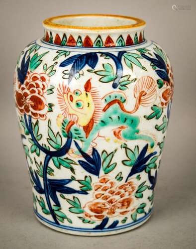 Porcelain jar. China. 19th century or earlier. Wu Tsai ware. Decoration of foo dogs and peonies in underglaze blue with red, green and yellow enamels. 7-1/2