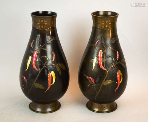 Pair of mixed metal vases. Japan. Meiji period (1868-1912(. Pear shaped. Inlay of pepper plants in gold, shakudo and copper. Signed. 8