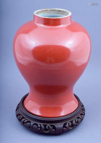 Porcelain Baluster vase. China. 19th century. Deep orange monochrome. Truncated and drilled. Kang Xi mark. 14