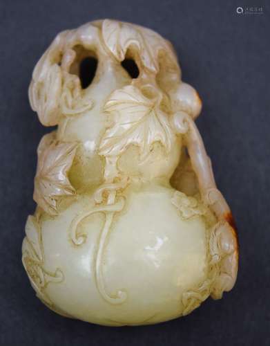 Jade carving. China. 18th century. Yellow white stone with deep russet markings. Carving of double gourds with foliage and a chih lung. 2-1/2