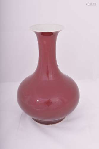 Porcelain vase. China. 18th century. Copper red glaze of a monochrome purple red. 11