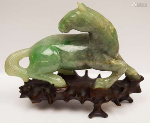 Jadeite horse. China. Late 19th century. Apple green with bright markings. Fitted stand. 4-1/2