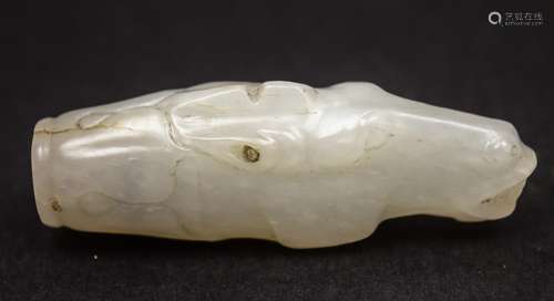 Jade carving. China. 18th century. Stone of a pure white colour. Finial carved in the form of a horses head. Natural fissures. 2-3/4