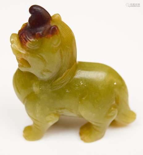 Jade carving. China. 18th century. Green stone with a russet marking. Figure of a standing Pi Hsieh animal. 2-1/2