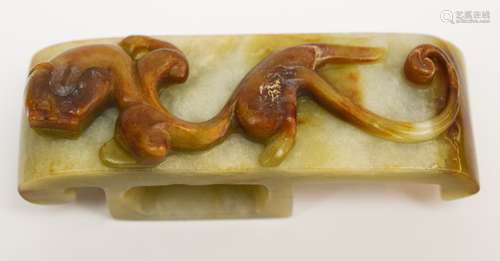 Jade scabbard slide. China. 19th century. Stone of a grey colour with an area of brown carved with a chih lung. 3