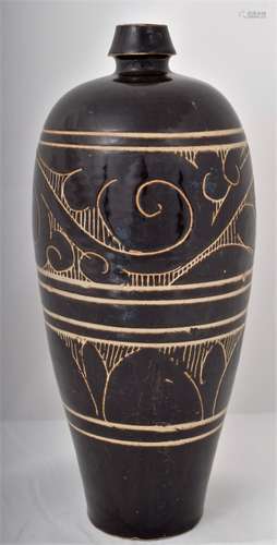 Stoneware vase. China. Sung period. 960-1279. Tzu Chouware. Dark brown glaze with bowstring marks and scroll and petal carving. Oxford testing results sample. No. P100K32. 28 April 2002. Dating consistent with the period stated. 13-1/2