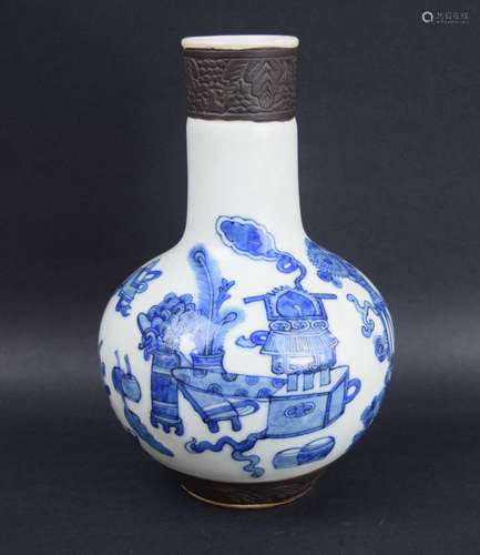 Porcelain vase. China. 20th century. Bottle form. Underglaze blue decoration of The Hundred Antiques. Borders of floral pattern mat brown. 10-1/2