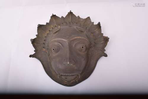 Bronze mask. South India. Early 20th century. Demon face.  Some pieces detached.  12