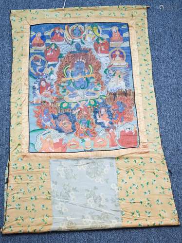 Buddhist Icon. Tibet. Early 20th century. Ink and colours on heavy cloth. Image of Makala surrounded by lineage  figures. 23-1/2