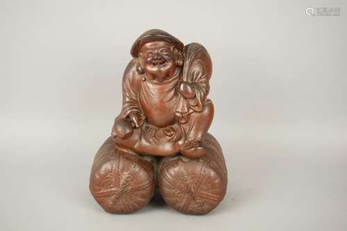 Stoneware figure. Japan. 19th century. Bizen ware figure of The God of Wealth. Daikoku. 10