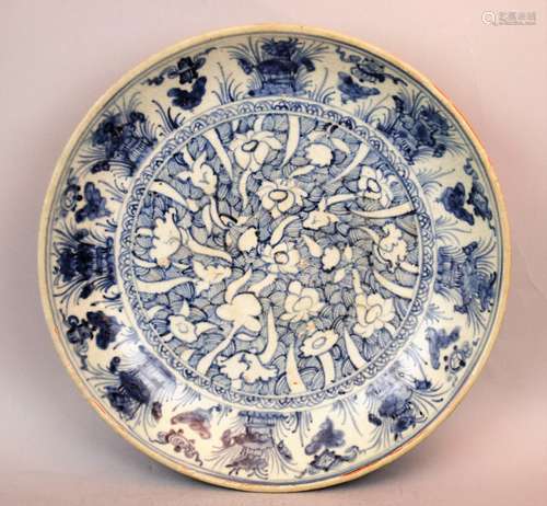 Porcelain bowl. China. Ming period. (1368-1644). Underglaze blue decoration of lotus plants. 13