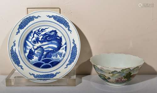 Lot of two Chinese porcelains. 19th-20th century. To include a Famille Rose bowl with a landscape and an underglaze blue dragon plate. 6-1/2