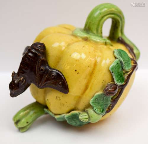 Water dropper. China. Early 20th century. Melon shaped with birds and foliage. Bat shaped stopper. San Tsai glaze of yellow green and aubergine. 4