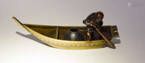 Mixed metals cabinet piece. Japan. Meiji period (1868-1912). Fisherman
rowing a boat. Bronze.