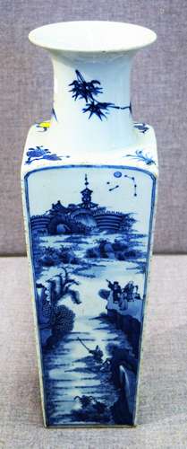 Porcelain vase. China. Late 19th century. Square form with a rounded trumpet mouth. Decoration in under glaze blue with a scholarly boating party. Extensive poems to either side. K'ang hsimark on the base. 19-3/4