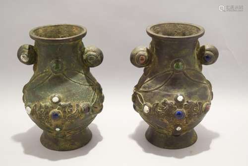 Pair of bronze vases. China. 20th century. Decoration of birds and floral motifs inset with glass cabochons. Hsuan Te mark on the base. 8-1/4