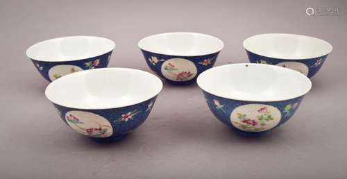 Lot of five porcelain bowls. China. Early 20th century. Scraffetto blue ground with floral reserves in Famille Rose enamels. 4-3/4