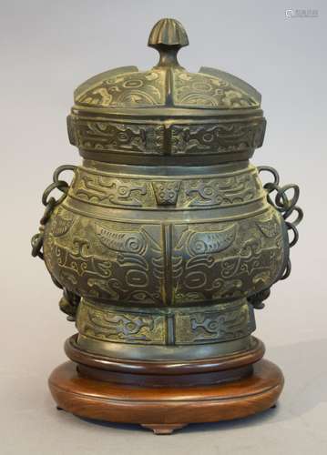 Archaic style bronze vessel. China. Late 19th-early 20th century. Western Chou style Yu. Lid with a four character inscription. Cracks to the sides. 15