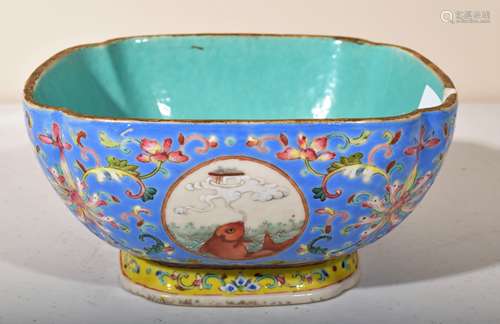 Porcelain bowl. China. Tung Chih mark (1861-1875). Square form with cut corners. Reserves of fish on a pale blue ground with Famille Rose floral scrolling. (chip). 6-1/2