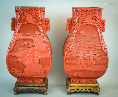 Pair of Cinnabar vases. China. 20th century. Fang Hu form. Decoration of agricultural scenes and floral scrolling. 12