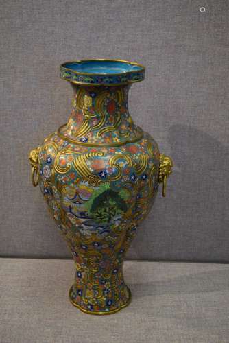 Cloisonné vase, China. Early 20th century. Lobated shape with swirling clouds of gilt drapery. Enamels of landscapes on a Millie fleur turquoise ground. Lion mask jump rings. 20-1/4