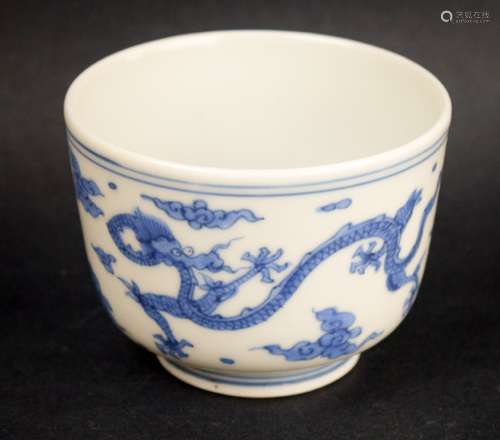 Porcelain bowl. China. 19th century. Underglaze blue decoration of dragons and clouds. Six character Ching Hua mark. (Hairline crack). 3-3/4