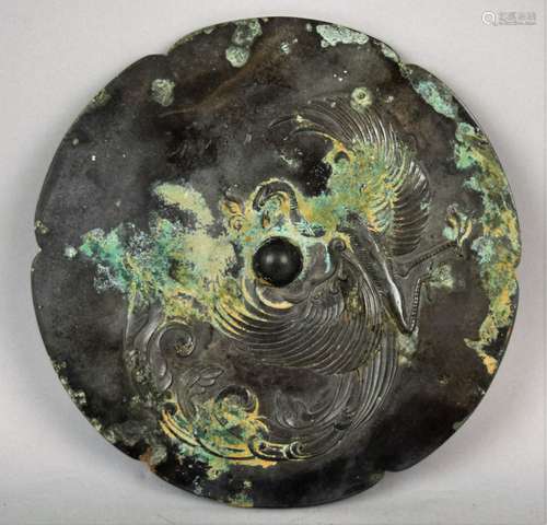 Bronze mirror. China. Tang period (618-920) Decoration of a phoenix. Silver patina with malachite and azurite incrustations. 7-1/2