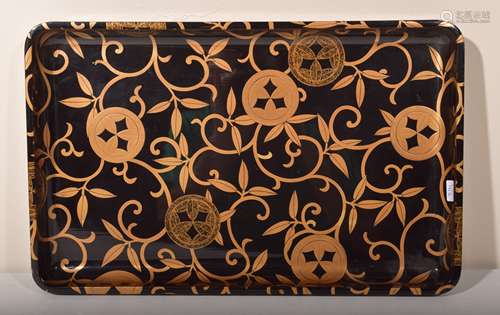 Lacquer tray. Japan. Meiji period. (1868-1912). Gold maki-e of heraldic mons and foliate tendrils on a black ground. Rectangular shape. 11-1/2