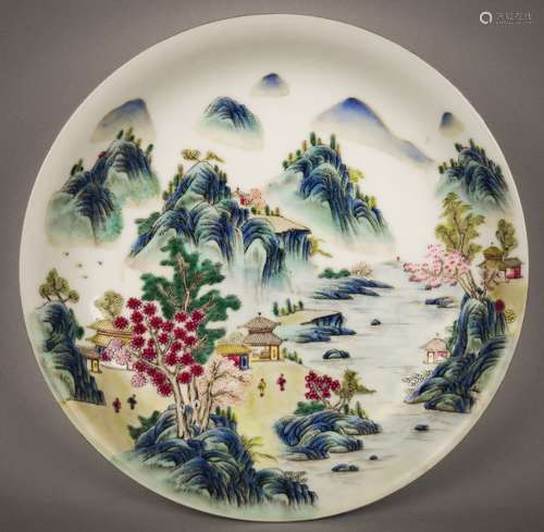 Porcelain saucer dish. China. 20th century. Famille Rose decoration of a landscape. Ch'ien Lung mark on the base. 7-1/2