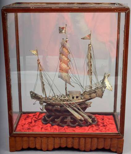 Silver model of a War ship. 19th or early 20th century. Carved wave shaped base. 7