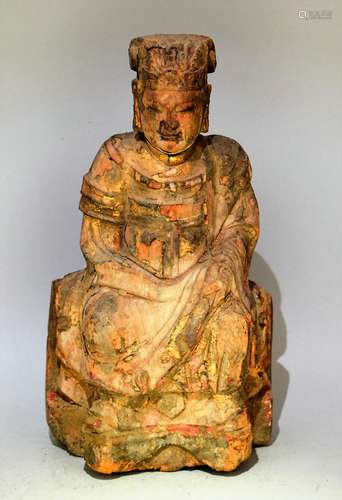 Carved wooden Divinity. China. 18th century or earlier. Seated figure. Traces of pigments and gilt remaining. (loss). 9-1/2