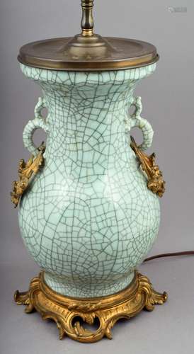 Porcelain vase. China. 19th century. Celadon with a pronounced crackle
and dragon hand.