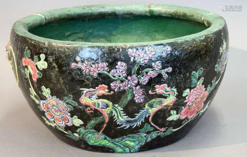 Pottery fish bowl. China. Polychrome decoration of dragons and clouds. (Old repairs). 16-1/2