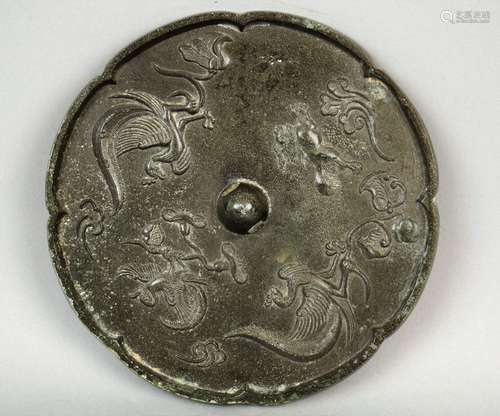 Bronze mirror. China. Tang period (618-920) Decoration of a phoenixes and a lion. Silver patina. 6-1/2