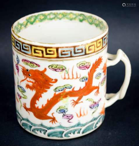 Chinese Export porcelain handle mug. 19th century. Straight sided decoration of dragons and clouds. Molded strap handle. Chip to the inside of the lip.  3