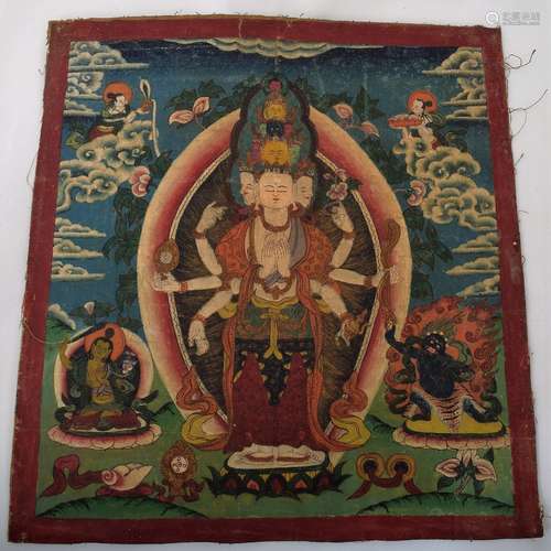 Buddhist Icon. Tibet. 19th/20th century. Ink and mineral pigments on heavy cloth. Central figure of the eleven head Avalokiteshvara surrounded by lineage figures.  Size: 10-1/4