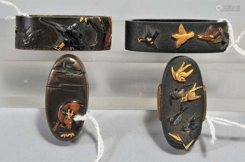 Two sets, Fuchi-Kashira, unsigned.  Japan. 18th/19th century. Copper with mixed metal inlay of gold and shakudo. A design of a hunter and a deer and one of birds on a nanuko ground.