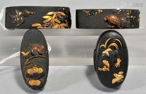 Two sets, Fuschi-Kashira, Japan. 18th/19th century. Copper inlaid with gold and shakudo on a nanako ground. Decoration of birds and flowers and birds and a rabbit. Both signed.