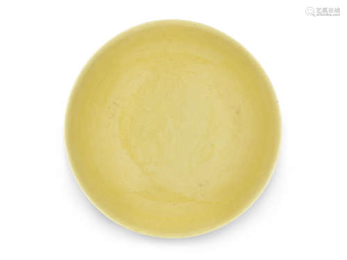 A small yellow-glazed incised 'dragon' saucer-dish
