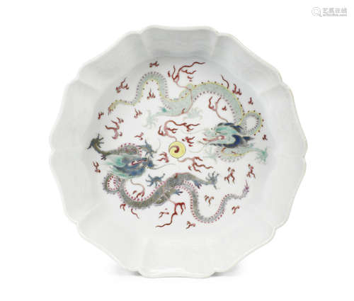 A famille rose 'confronting dragons' petalled dish