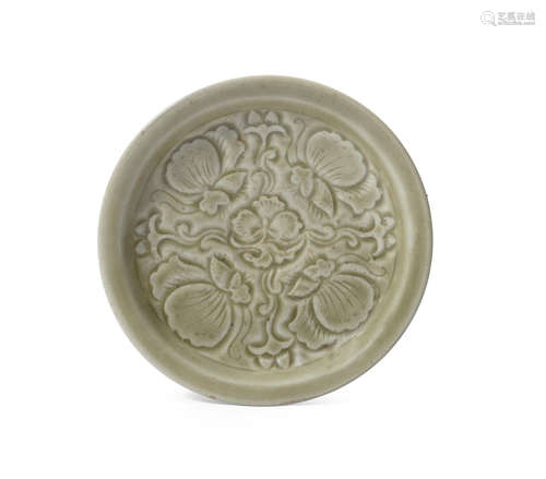 A carved celadon-glazed dish