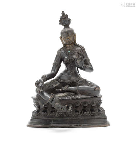 A large bronze figure of Green Tara